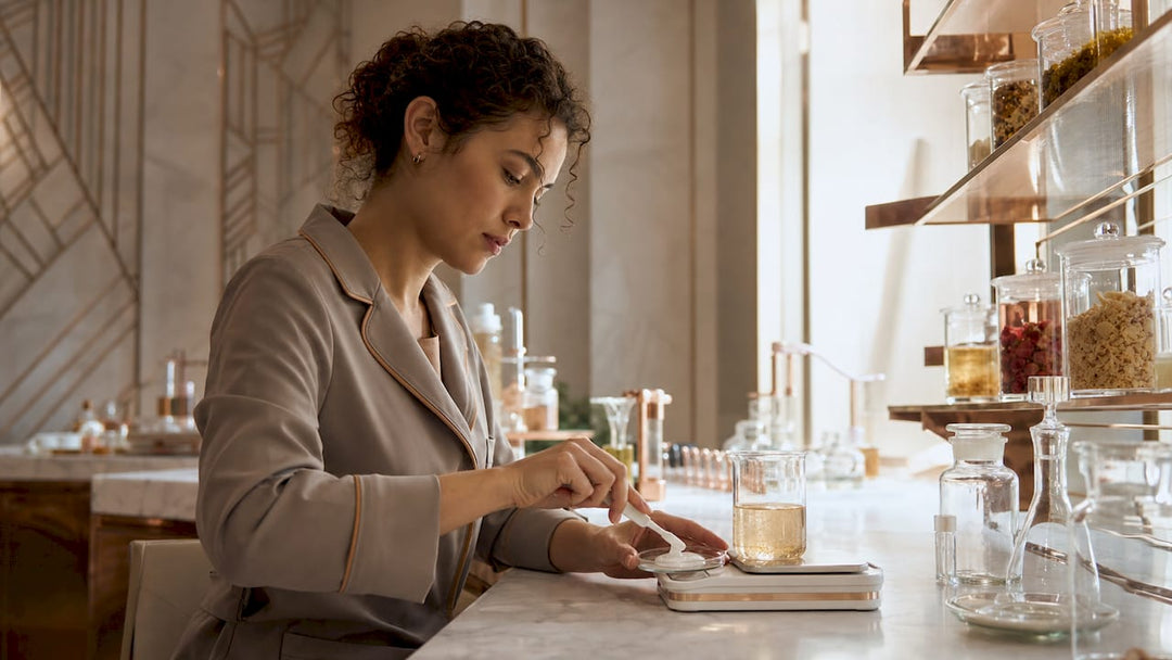 Cosmetic chemist analyzing cream texture in lab