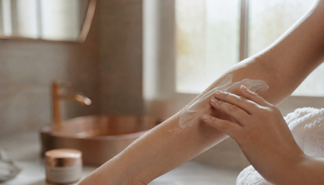 Hand applying moisturizer to skin